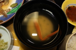 miso soup with a crab leg